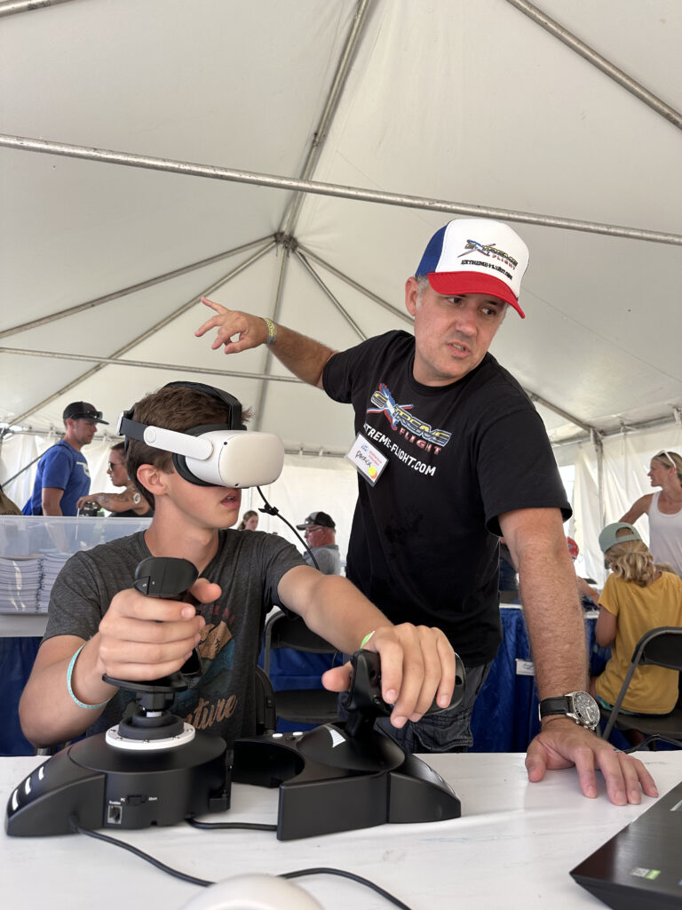 Patrick McAlee introducing young kids to aerobatic aviation