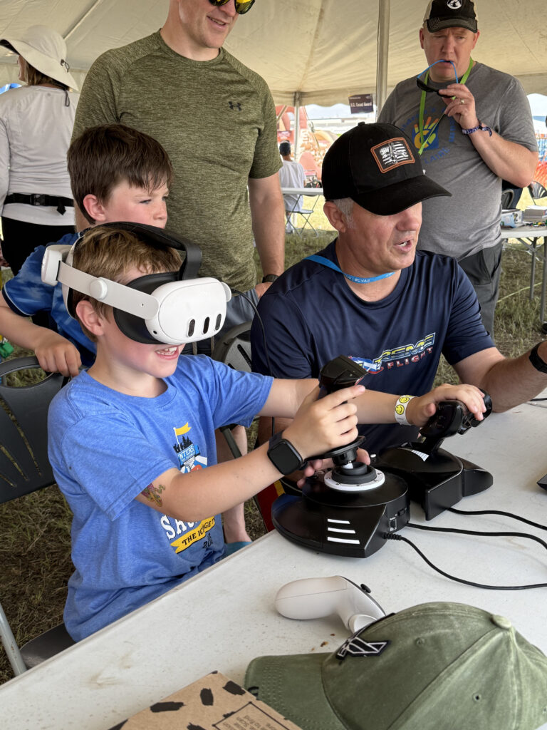 Patrick McAlee with boy in VR